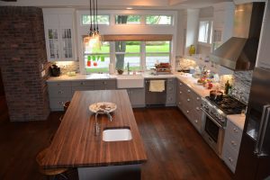 Kitchen-with-brick-accents-and-butcher-block-island